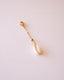 Charm cauris monté sur chaine boule blanche